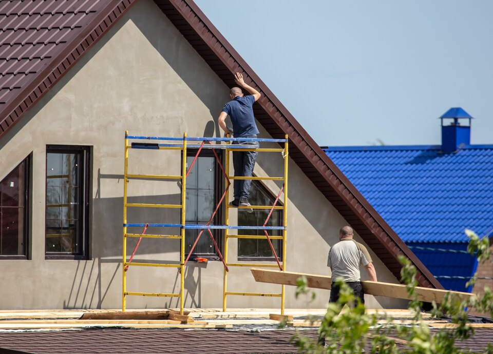 2 men doing building work